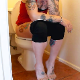 A girl with tattoos has diarrhea while sitting on a toilet in 3 scenes. Some plops are heard as well. See movies 9899 and 10006 for more. About 11 minutes.